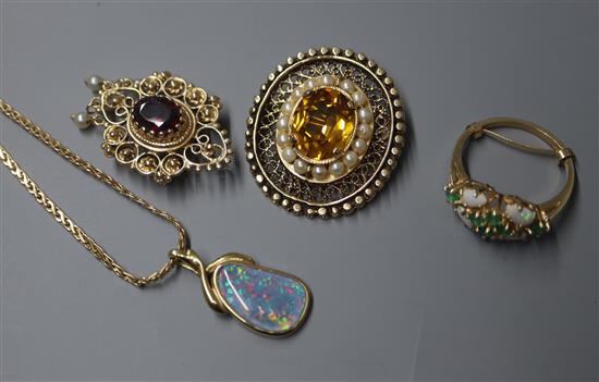 A 14k and gem set pendant, one other 14k pendant, a yellow metal and gem set brooch and a 14k ring.